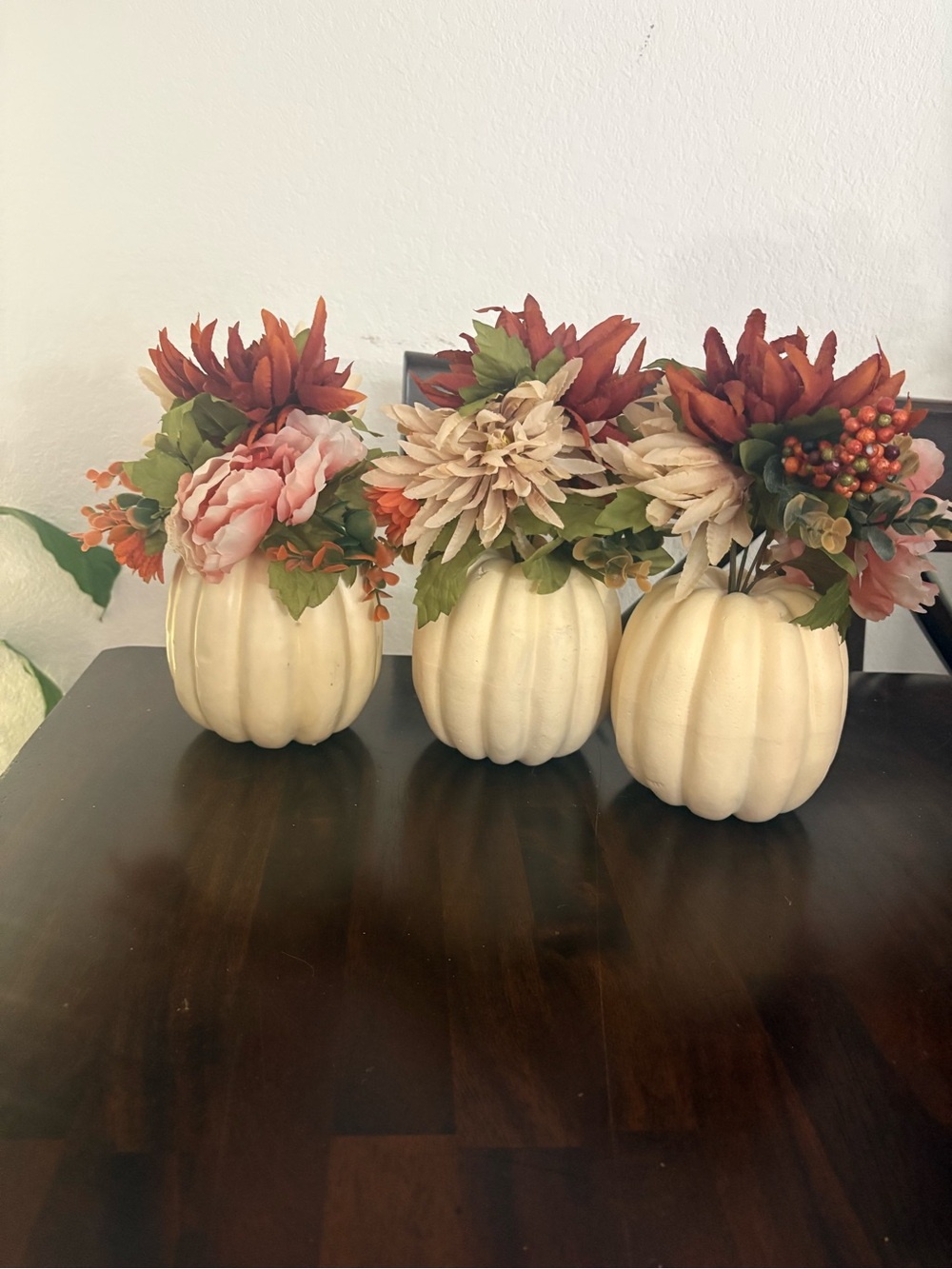 Three faux fall pumpkin flower bouquets